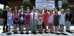In May, Terry Watkins (l), chapter Educational Committee chair, gathers with the high school seniors receiving chapter scholarships.